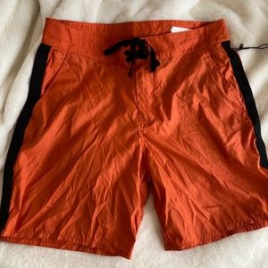 outer known eco orange swim trunks